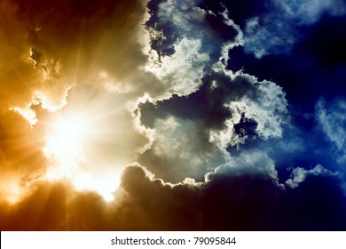 Dramatic Impressive Background -  Sky With Bright Sun And Dark Clouds