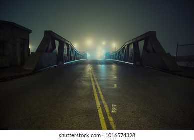 Dramatic Industrial Vintage River Road Bridge Street Scene At Night With Illuminating Fog In Chicago.