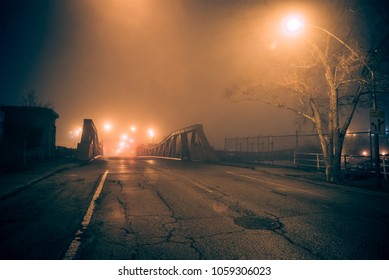 Dramatic Industrial Vintage River Road Bridge Street Scene At Night With Illuminating Fog In Chicago