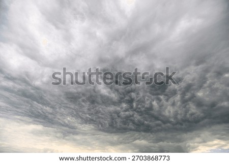 Dramatic and Intense Dark Storm Clouds Gather Menacingly and Forebodingly in the Sky Above Us