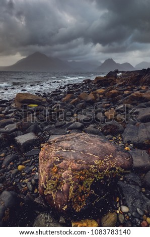 Dramatic landscape coastline view of rocks and Cullin hills, Scotland, United Kingdom