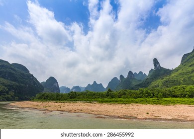 Dramatic landscape of limestone karst besides Li river which flows from Guilin to Yangshuo in China.