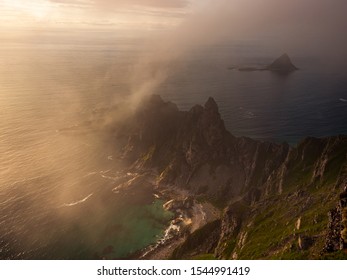 Dramatic landscape from northern Norway. Coastline and mountains with fog from the sea. Image from the island of Andøya. 