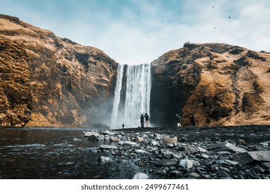 Dramatic landscape of powerful Skogafoss waterfall flowing from volcanic mountain in autumn at South of Iceland - Powered by Shutterstock