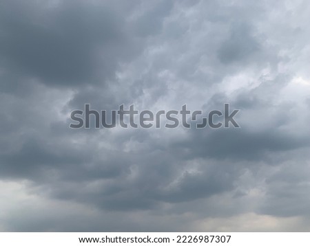 Dramatic landscape of stormy sky Nimbostratus Clouds A gray Style rolls and Huge scary storm it's going to rain heavily at Bangkok, Thailand.no focus