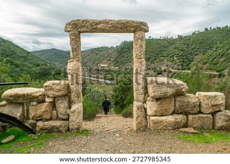 Dramatic Landscape of the Tejo River Seen Through a Traditional Stone Arch
