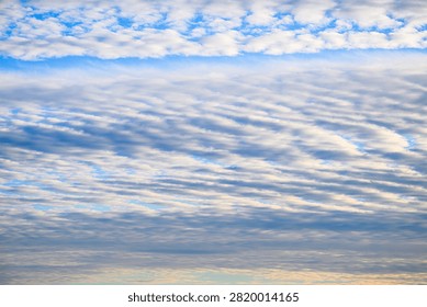 Dramatic layered cloud formation spreading across evening sky