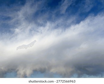Dramatic layered clouds fill the sky in striking diagonal bands, ranging from dark gray storm clouds at the bottom to wispy high-altitude cirrus formations beneath a vivid deep blue sky