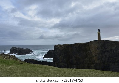 Dramatic Lighthouse Beacon on Sea Cliffs with Stunning Ocean Sce