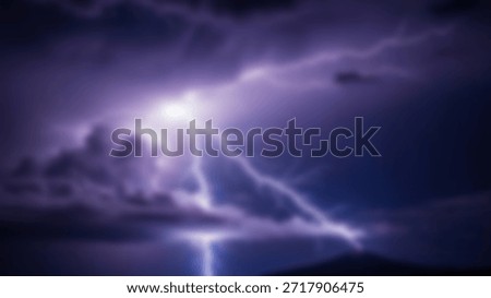 A dramatic lightning storm illuminates a mountain peak under a menacing, dark sky.
