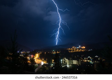Dramatic lightning strike over mountains resort