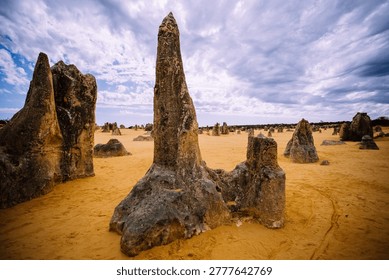Dramatic Limestone Pinnacles Rising from Orange Sand Under Stormy Sky, Nambung National Park Western Australia