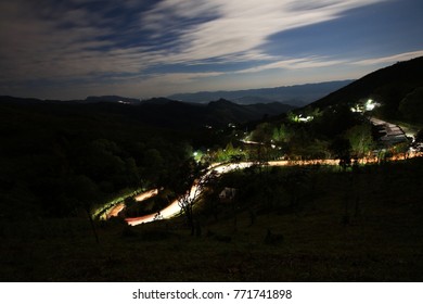 dramatic long exposure sky and traffic light trails at Doi Pha Tang, Chiang Rai Province, Thailand