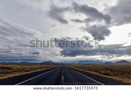 Dramatic looking sky and clouds with mountain background in high desert, near Arizona Utah border