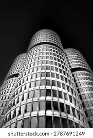 Dramatic Low Angle Monochrome Shot of Unique Cylindrical Skyscraper Architecture, Munich, Germany