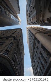  Dramatic low angle view of four high-rise buildings and skyscrapers reaching towards the sky in downtown Rio de Janeiro, Brazil, urban canyon concept