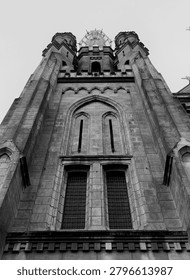 Dramatic Low Angle View of Jakarta Cathedral, Historic Gothic Revival Church and Roman Catholic Landmark in Jakarta, Indonesia, Monochrome Architecture Photography