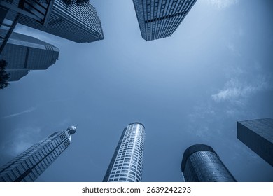 Dramatic Low Angle View of Skyscrapers Against Clear Blue Sky  