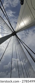 Dramatic low-angle worm's-eye view looking straight up into the architectural cable-stayed pylon structure of the iconic Tengku Fisabilillah First Barelang Bridge in Batam, Indonesia.