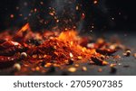 Dramatic macro shot of a fiery red chili powder mound erupting in glowing sparks and embers on a dark slate surface, surrounded by scattered dried red chilies, black peppercorns.