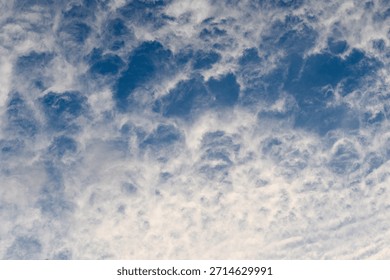 Dramatic and Mesmerizing Cloud Patterns Formed in a Stunningly Beautiful Blue Sky Above the Horizon