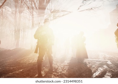 Dramatic Misty View On German Wehrmacht Infantry Soldier In World War Ii Standing In Dramatic Backlight Through Smoke During Historical Reenactment. Black And White Colors. Yellow Sunlight, Sunbeam.