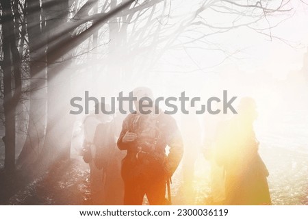Dramatic Misty View On German Wehrmacht Infantry Soldier In World War Ii Standing In Dramatic Backlight Through Smoke During Historical Reenactment. Black And White Colors. Yellow Sunlight.