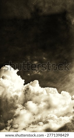 Dramatic monochrome cumulus clouds against a dark, textured sky. This moody, vintage-style atmosphere features high contrast and grainy artistic details, perfect for dramatic backgrounds and fine art.