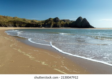 Dramatic and monolithic Three Cliffs Bay on the Gower peninsula, South Wales, UK