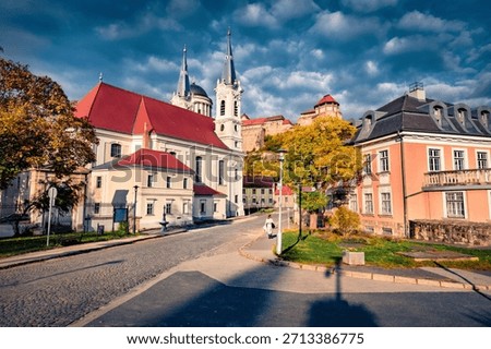 Dramatic morning clouds above the St Ignatius Church and Basilica of Esztergom. Amazing autumn cityscape of Esztergom town, Komarom-Esztergom County, Hungary. Traveling concept background.