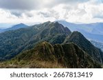 Dramatic mountain cliffs dominate the landscape of Mae Hong Son, Thailand, showcasing the province