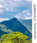 Dramatic mountain cliffs at World’s End, Sri Lanka, surrounded by dense green forest and soft clouds. Iconic viewpoint in Horton Plains showcasing the raw beauty of Sri Lanka’s highlands.