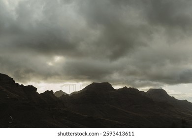 Dramatic Mountain Landscape Under Cloudy Sky