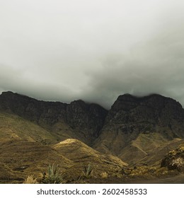 Dramatic Mountain Landscape Under Cloudy Sky