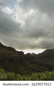 Dramatic Mountain Landscape Under Cloudy Sky