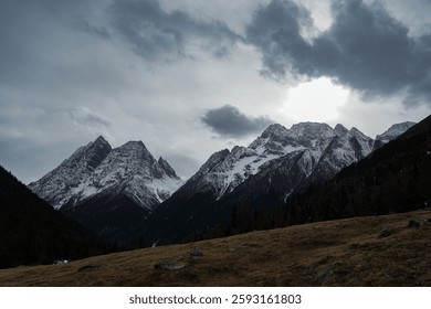 Dramatic mountain range at dusk alpine region photography natural landscape wide-angle view majestic beauty