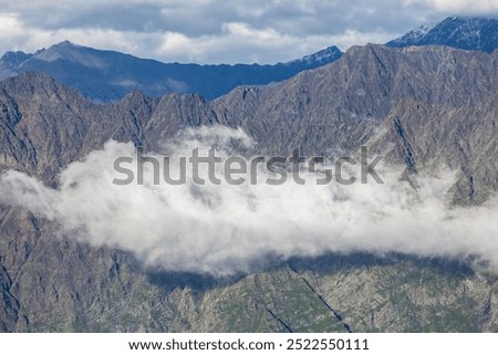 Similar – Image, Stock Photo Morning clouds rolling over the scenery and mountains over the Czech Republic creating different formations based on temperature, pressure and airflow. Meteorology