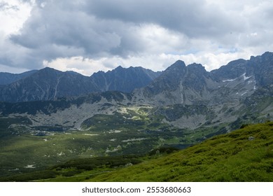 Dramatic Mountain Range under Cloudy Sky