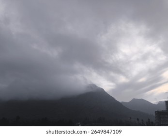 Dramatic Mountain Scene Under Cloudy Sky