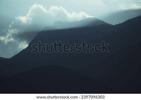 Dramatic mountain scenery in the Accursed Mountains above the city of Peja in Kosovo at sunset.