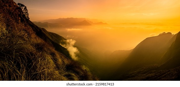 Dramatic Mountain Sunrise View With Clouds, Beautiful Golden Hour Image Takes From Munnar Kolukkumalai Kerala, Amazing Sunrise Over Misty Mountain Landscape	