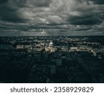 A dramatic night sky featuring storm clouds over the skyline of London, England