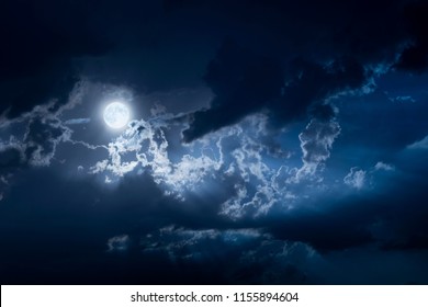 Dramatic Nighttime Clouds And Sky With Beautiful Full Blue Moon