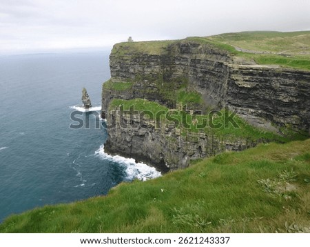 Dramatic Ocean Cliffs
Towering above the wild Atlantic, these ancient cliffs stand as nature’s fortress—carved by wind and time. Waves crash violently against the rocks below, sending up sprays 