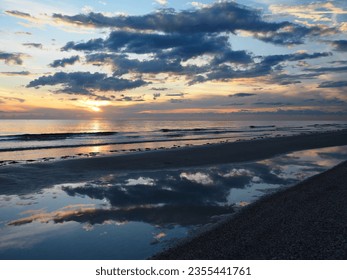 Dramatic Ocean Sunset and Tidepool Reflection