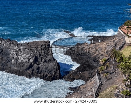 Dramatic Ocean Waves Crashing Into Natural Rock Pool at Crab Island Los Gigantes