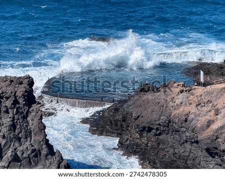Dramatic Ocean Waves Crashing Into Natural Rock Pool at Crab Island Los Gigantes