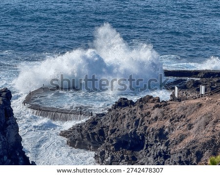 Dramatic Ocean Waves Crashing Into Natural Rock Pool at Crab Island Los Gigantes