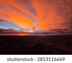 Dramatic orange cloud rays above the Grand Canyon at dusk, United States