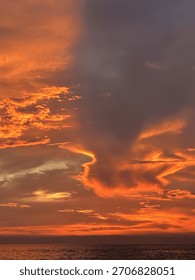 Dramatic Orange and Red Sunset Over the Ocean Horizon